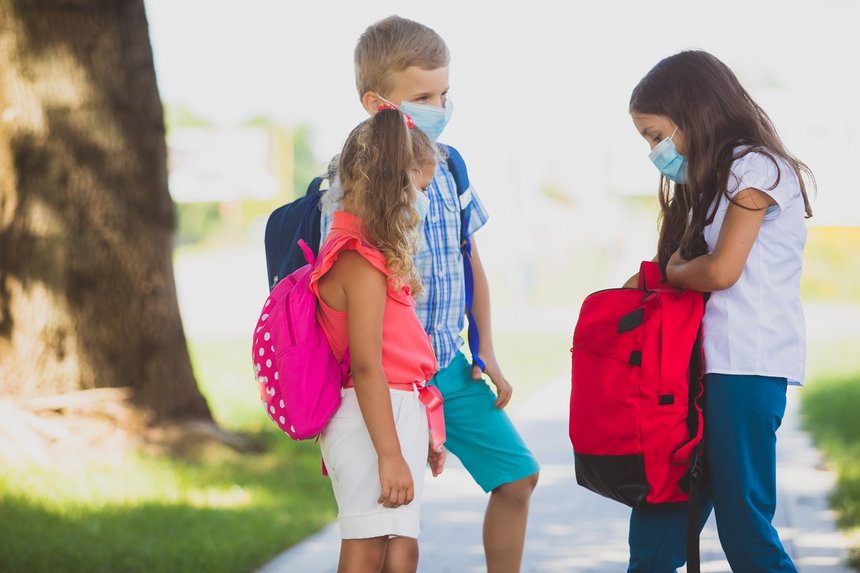 The kids happily communicate when they return to school