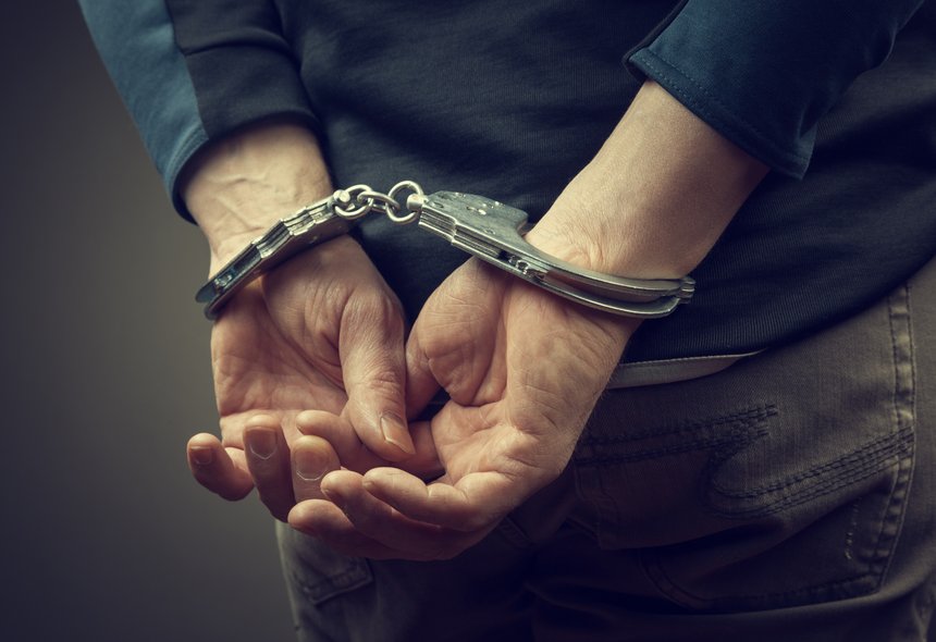 male hands in handcuffs