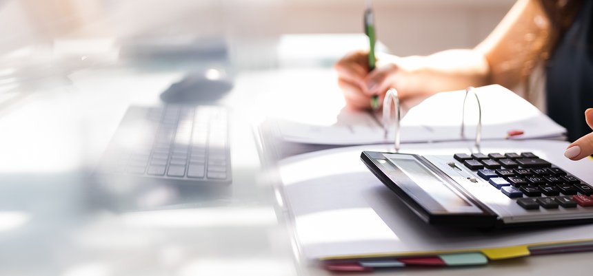 Chartered Accountant Hand Calculating Tax