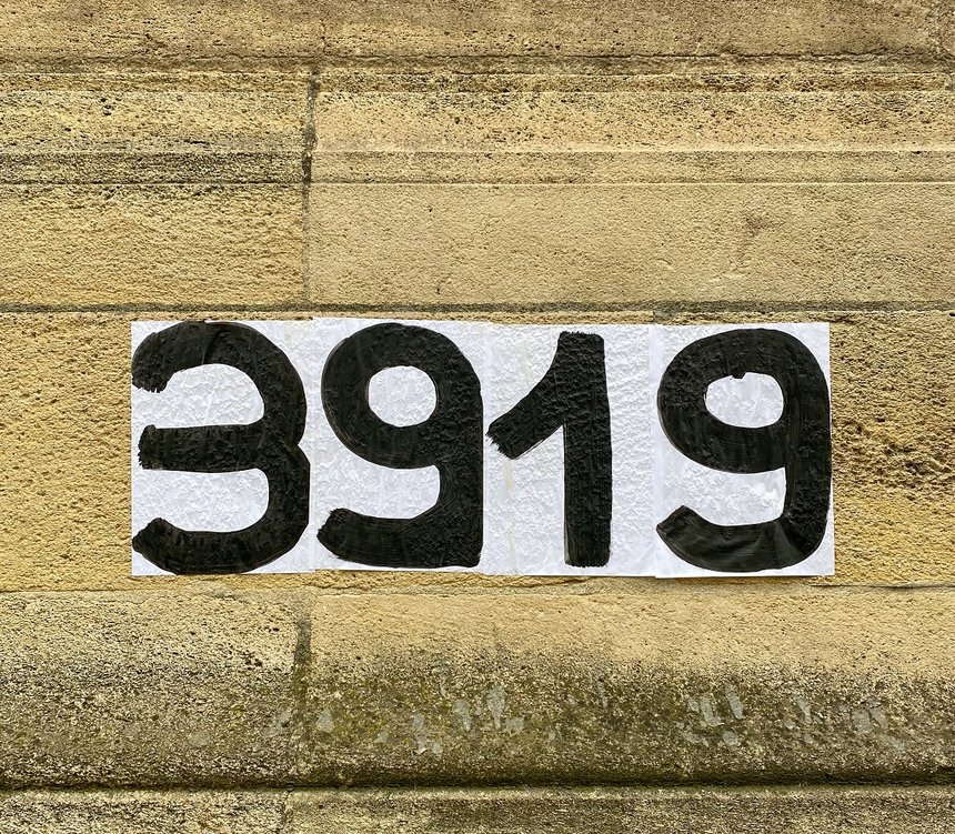 Protest poster pasted by members of a feminist promoting the 3919 the telephone number for women victims of violence in France