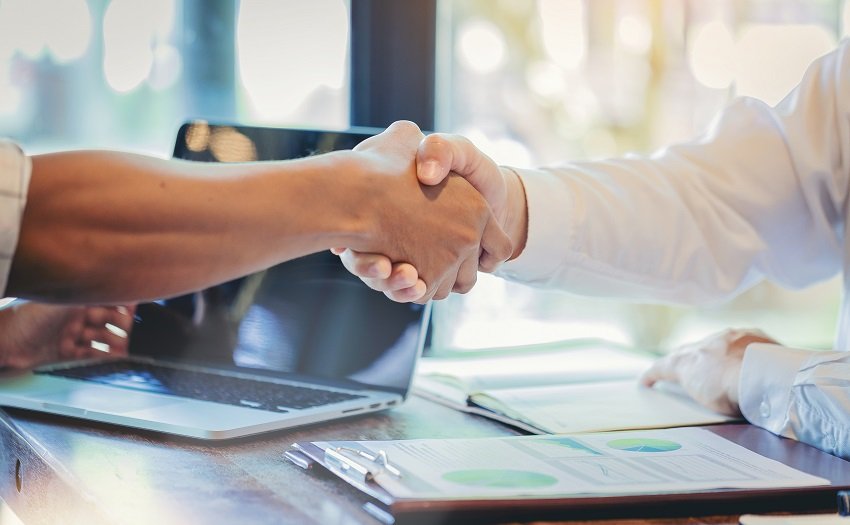 Businessman handshake at business meeting after negotiations with business partners.