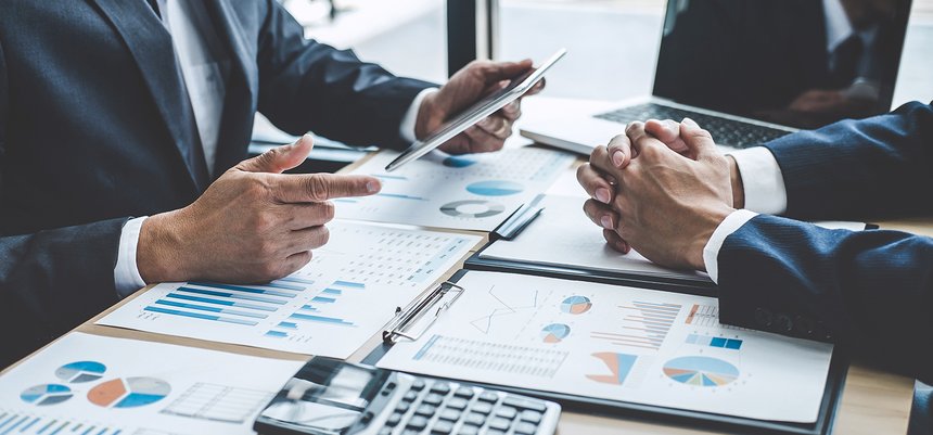 Two executive discussing company growth project success financia
