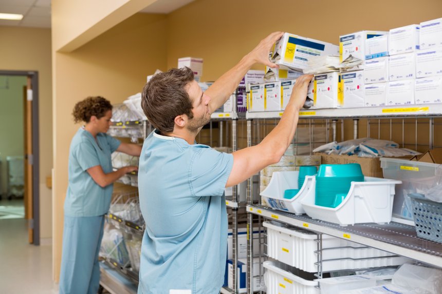 Nurses Arranging Stock In Storage Room