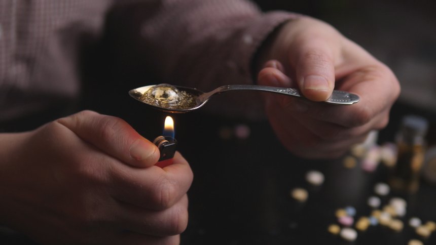addict preparing dose of crack
