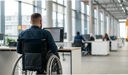 Man with disabilities at work. Guy in wheelchair in office among colleagues. Disability Employment Awareness Month. Employment, inclusion, Disability Rights, Inclusivity concept. World Disability day